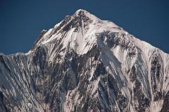 Annapurna 11 02 Annapurna II On The Way To Chame On the way to Chame, I had this magnificent view of Annapurna II (7937m) peaking out from the trees, with the summit ridge leading from right to left.